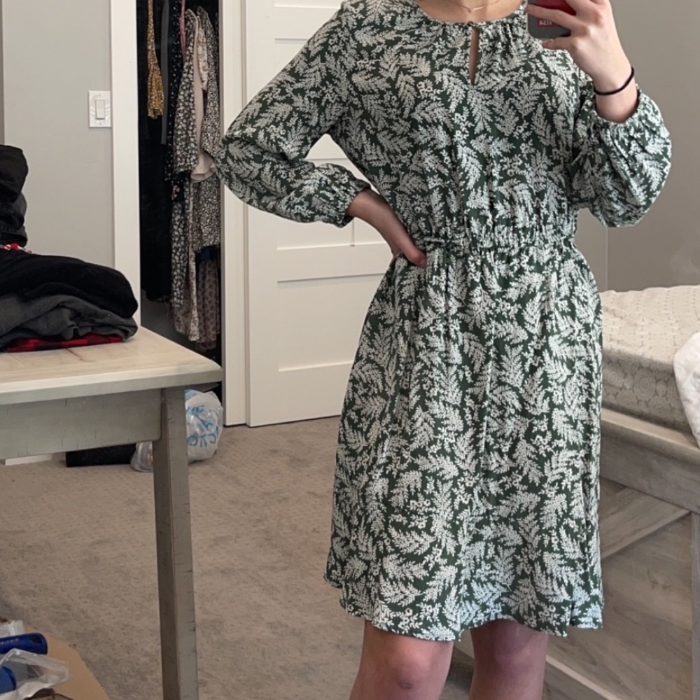 dark green dress with a leaf pattern
